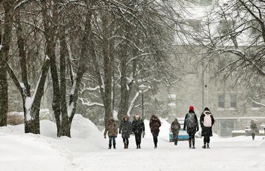Students walking near campus on snowy day